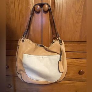 Large Tan shoulder bag with outside zip pocket and animal print inside